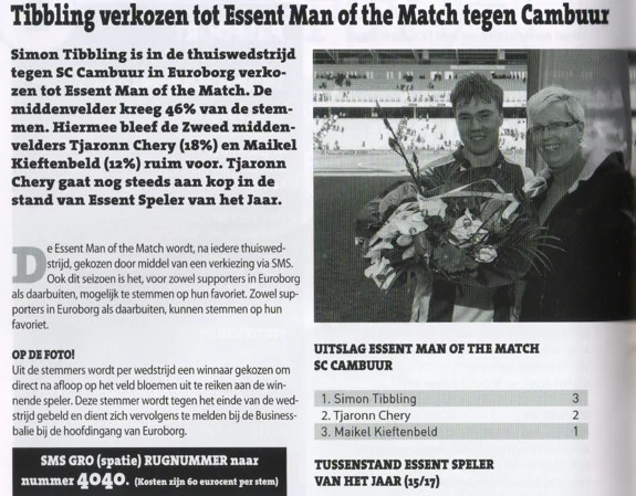 photo of Simon Tibbling smiling with his flowers and award from page 18