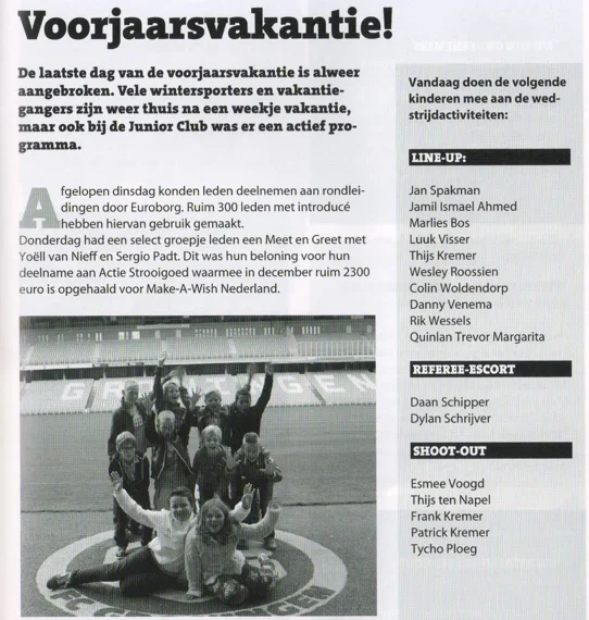 black-and-white photo of the Junior Club children posing cheerfully in the stands of the Euroborg from Groningen ADO Den Haag programme 2015.
